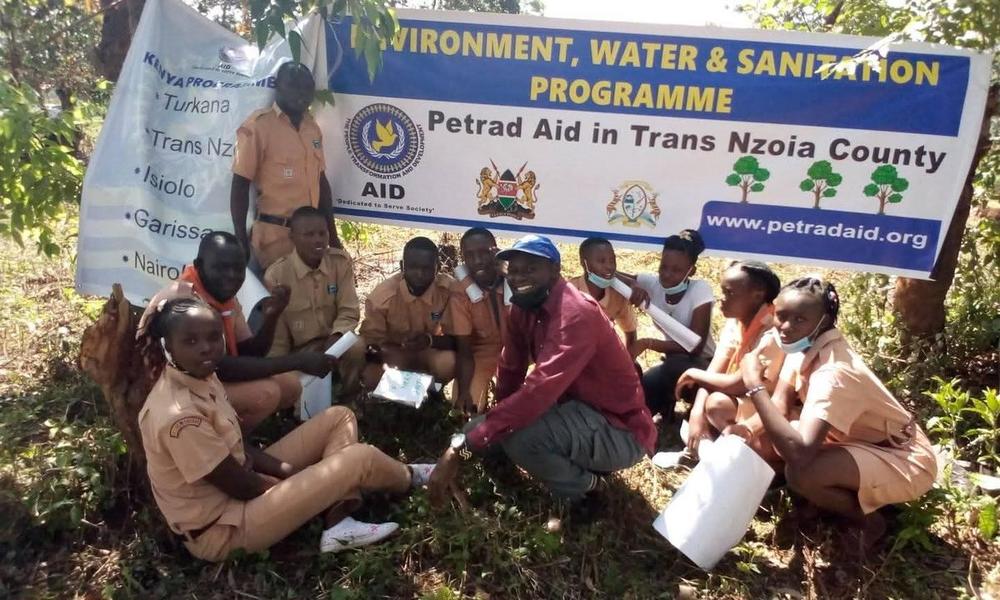 PETRAD AID volunteers and community members group tree planting — Nairobi City County environmental partnership